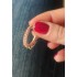 Halkalarla süslü gümüş oval halka küpe